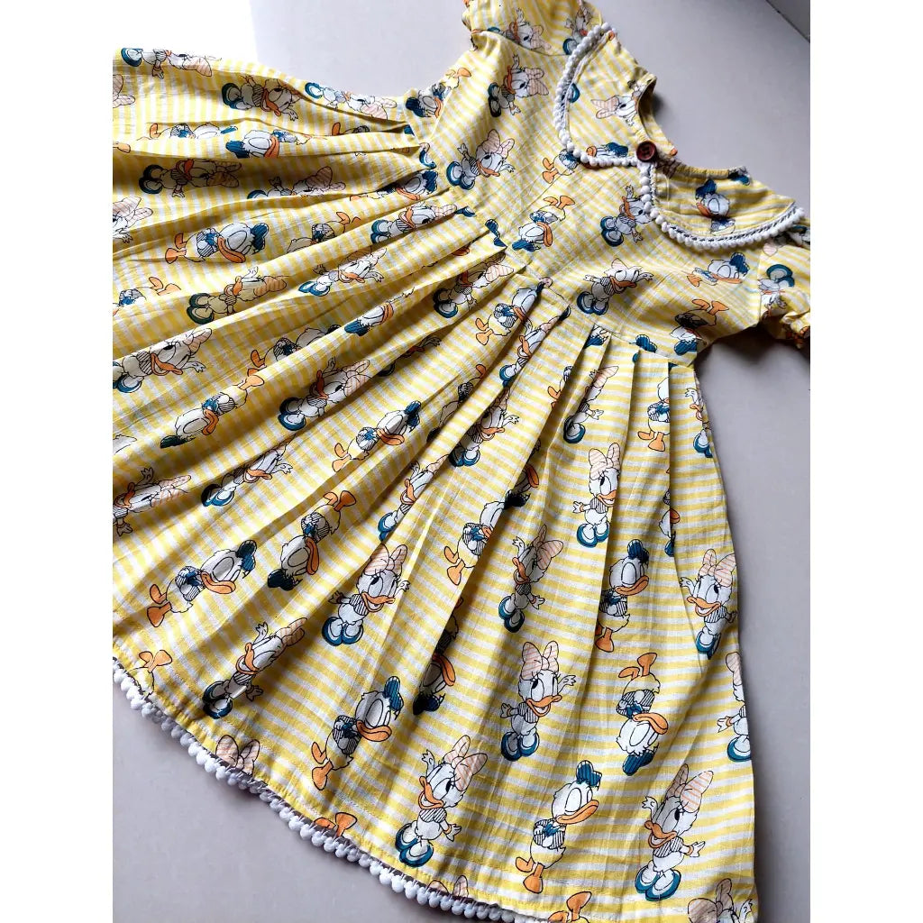 yellow cartoon print cotton frock for girls – donald & daisy duck design