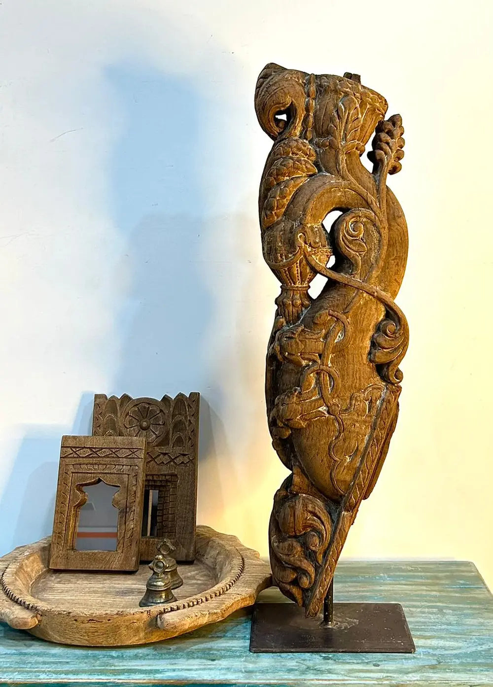 vintage hand-carved wooden balcony bracket on iron stand | antique architectural decor