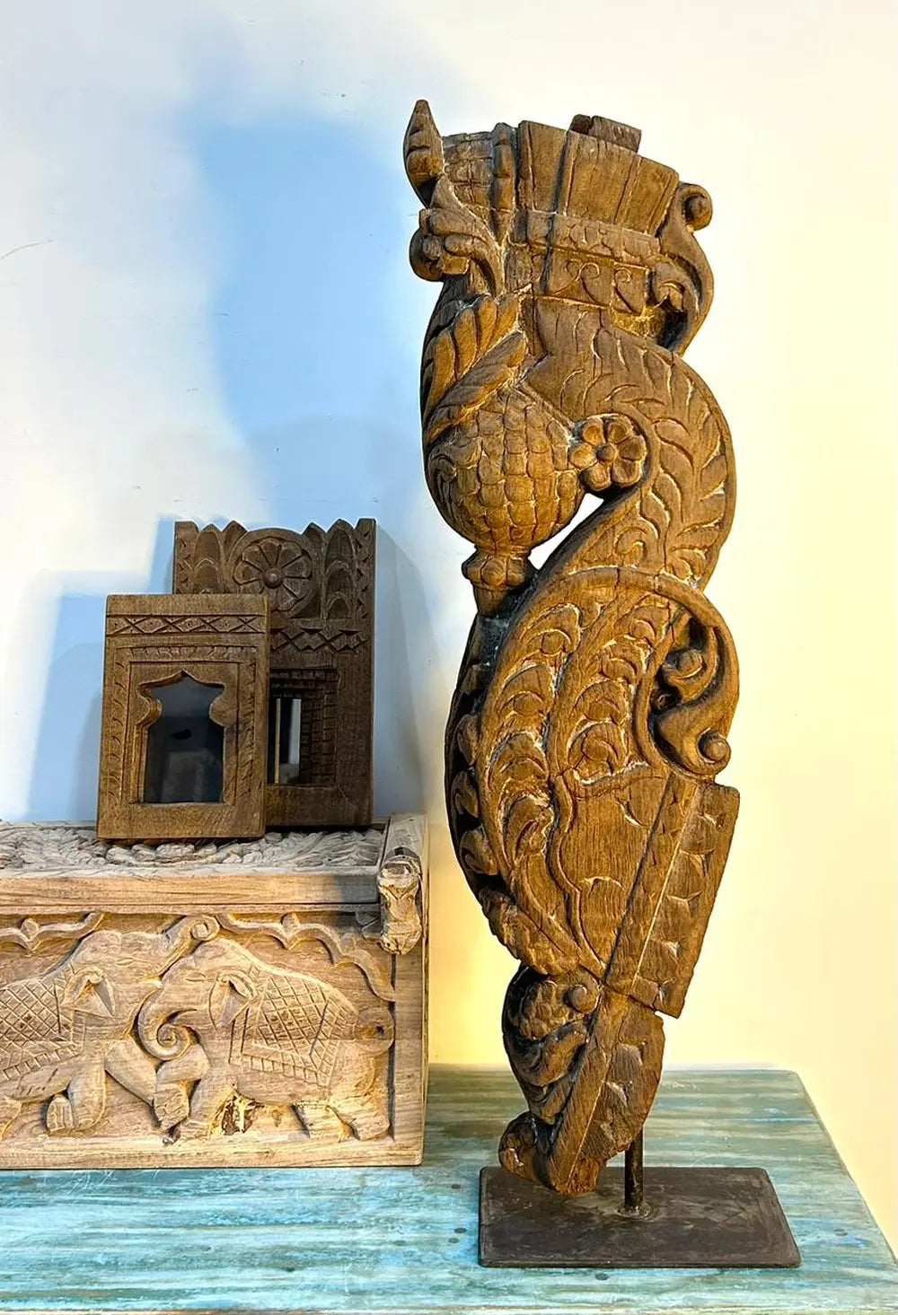 vintage hand-carved wooden balcony bracket mounted on iron stand | antique decorative piece