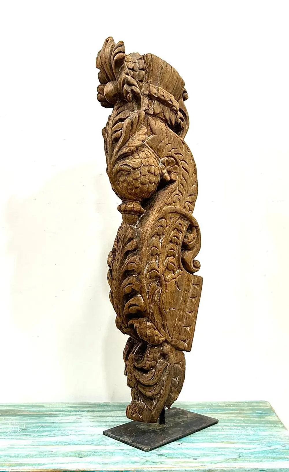vintage hand-carved wooden balcony bracket mounted on iron stand | antique decorative piece