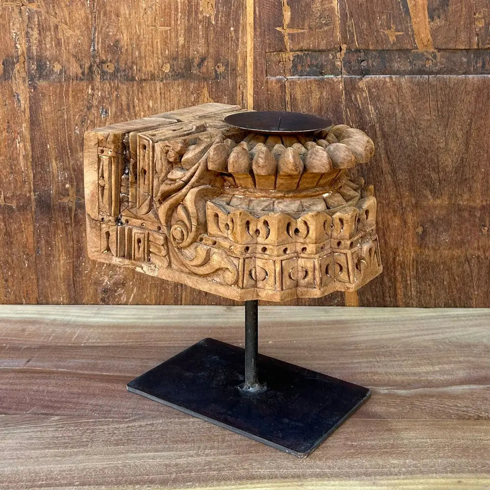 vintage hand-carved wooden candle holder on iron stand