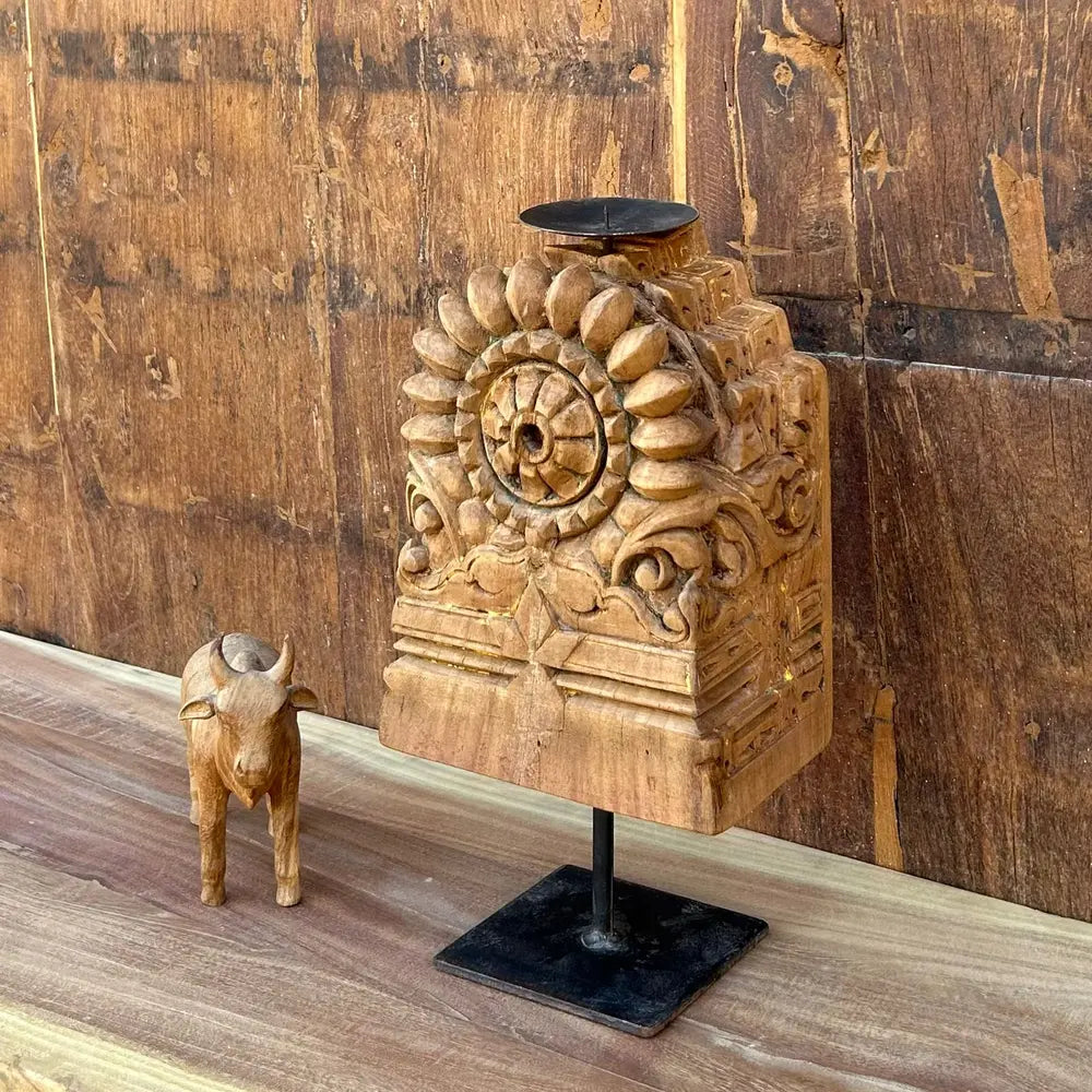 vintage hand-carved wooden candle holder on iron stand